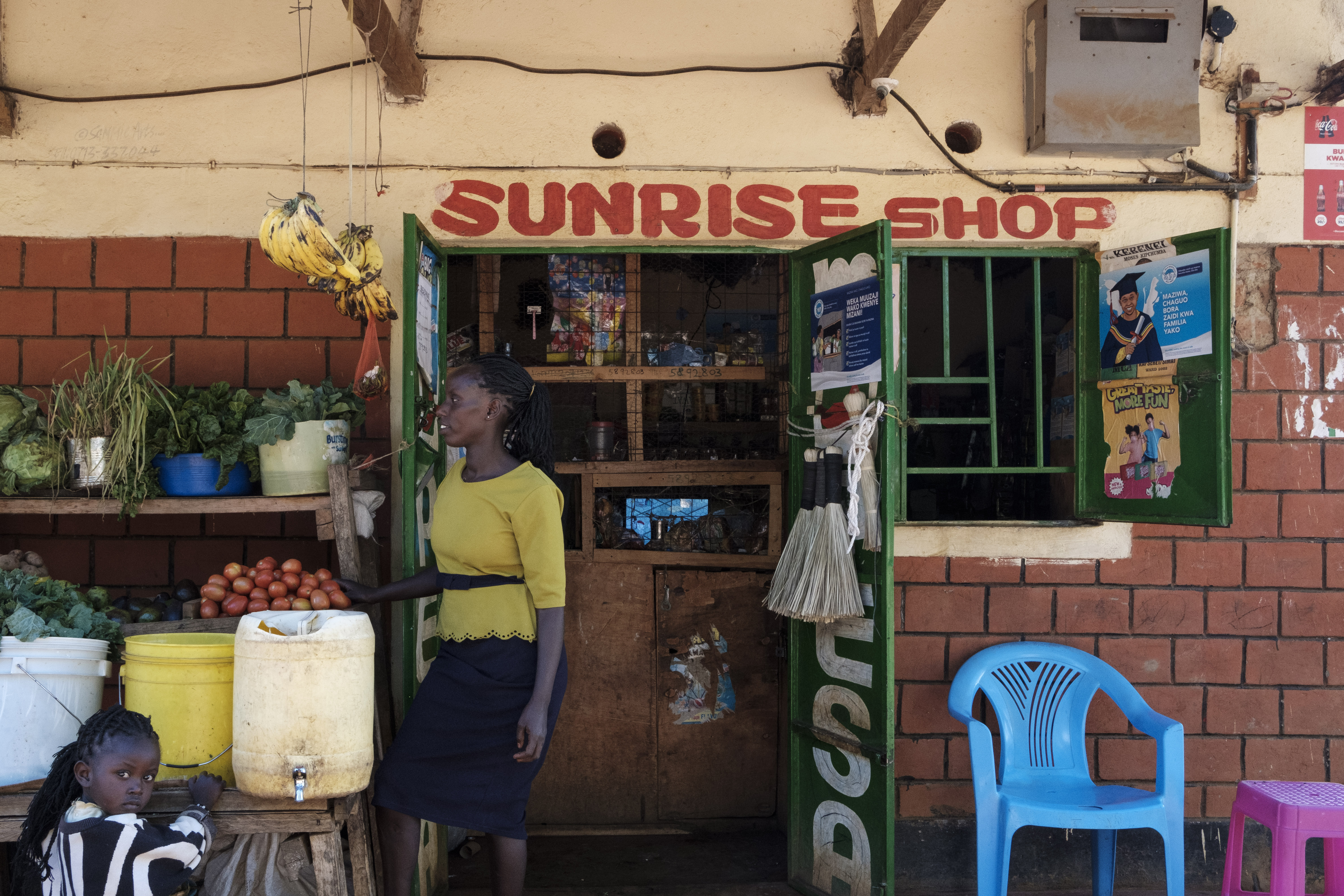 Lois Jemutai in front of her shop