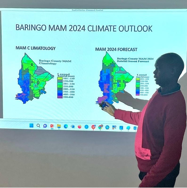 Samuel Mutai, Baringo County Director Meteorological Services, presents the KMD’s Baringo county weather forecast. The rainfall data is broken down to ward level, comparing historical rainfall averages with the 2024 predicted rainfall amounts (photo: ILRI/Kristen Tam).