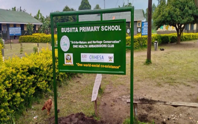 Left: some of the art pieces made by the children and right; a signpost at one of the schools (photo credit: COHESA/YOLIDA).