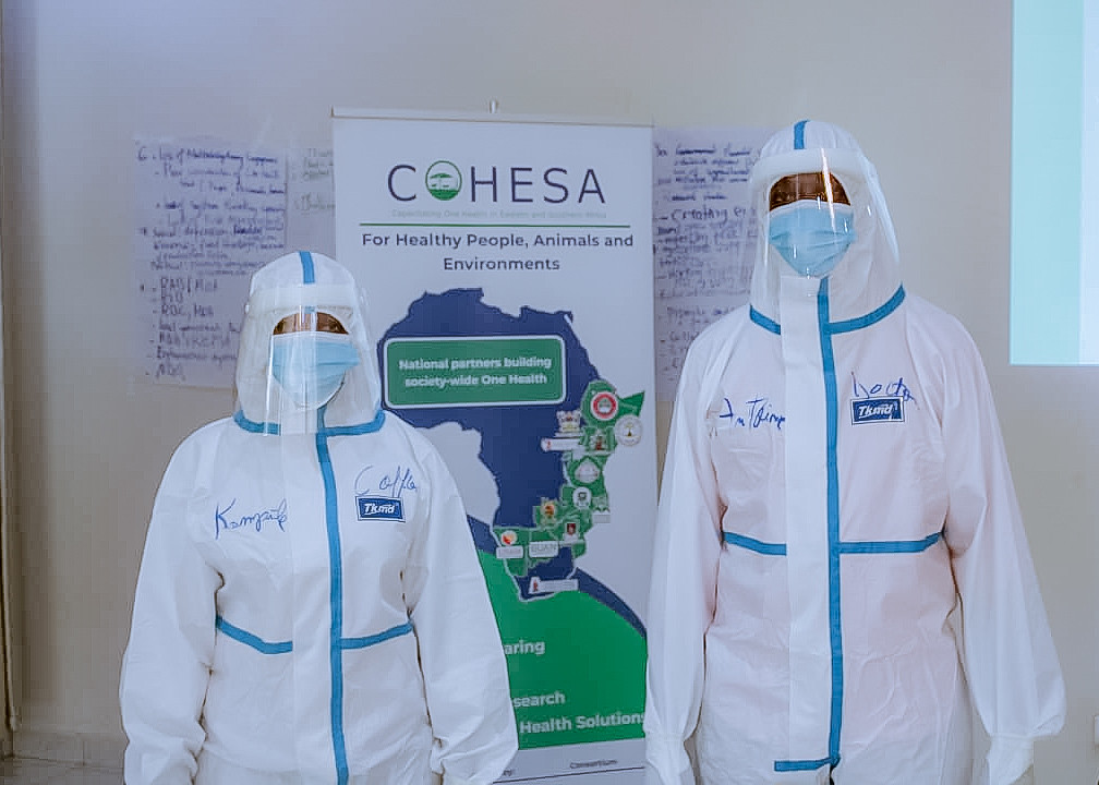 Students try on personal protective equipment during the training (photo credit: COHESA/ Jean de Dieu Mana)