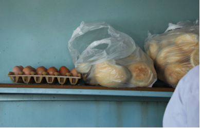Eggs and bread on a shelf</p>
<p>Description automatically generated, Picture