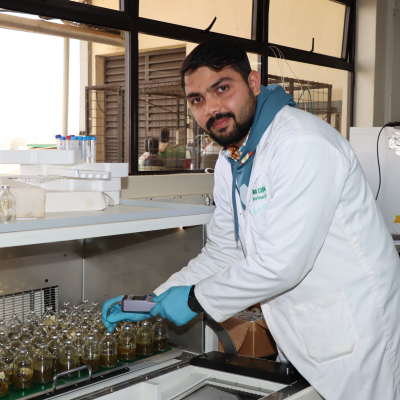 Mohapatra takes a gas reading from fermentation bottles incubated at the ILRI Mazingira Centre (photo credit: ILRI/Grace Oduor).