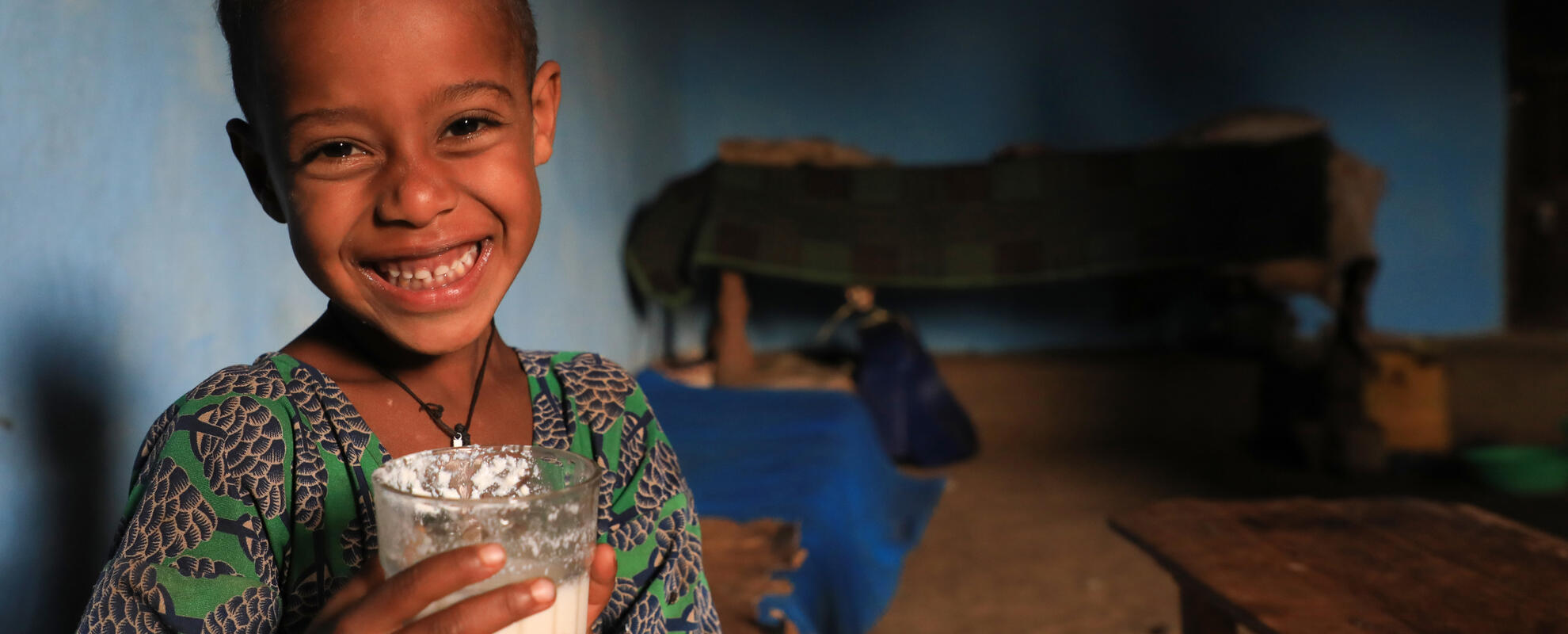 Girl drinking milk, Ethiopia. (ILRI)