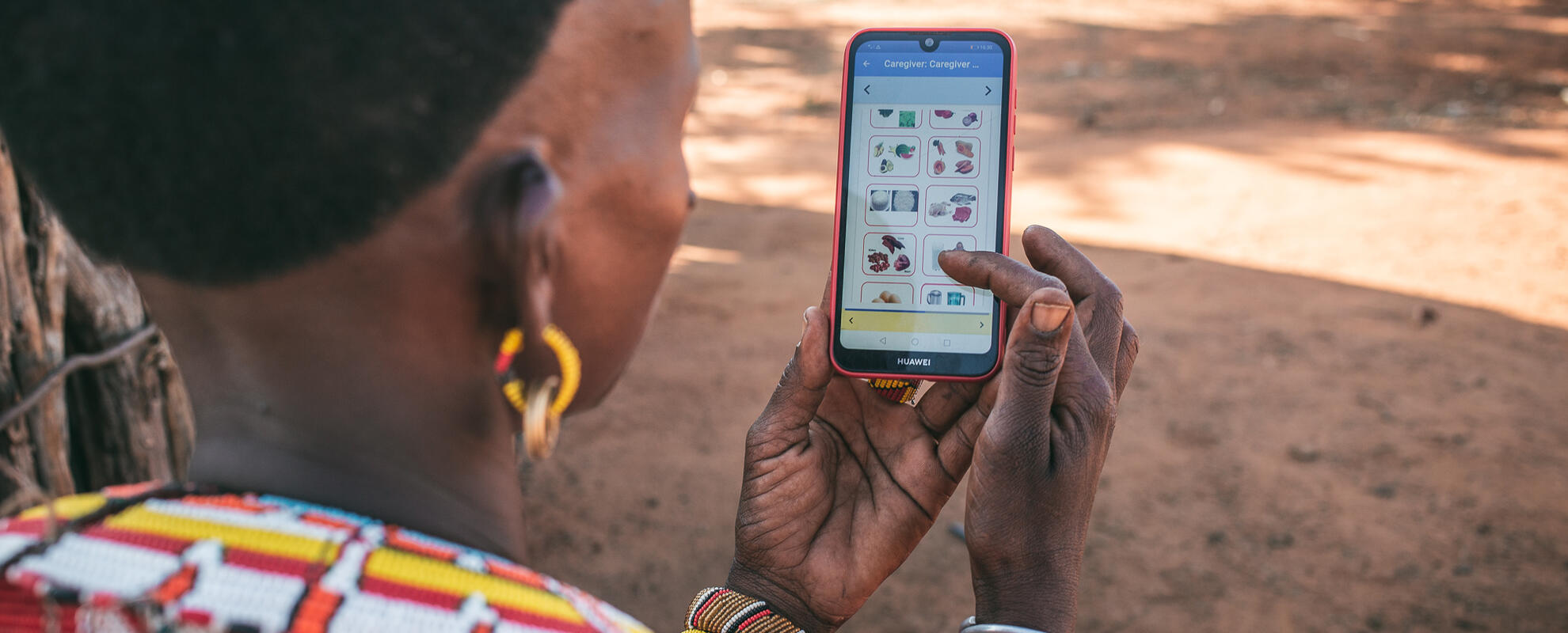 Samburu woman using the Mbiotisho app (ILRI).