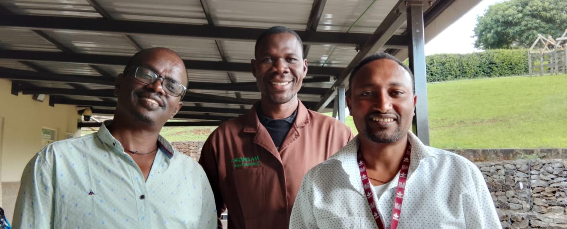 PhD students Demissie Dawana (left) and Tegegn Fantahun (far right) from the Mazingira Centre spent time with Loyapin Bondé (center) to demonstrate and explain how the biodigester is an effective tool to reduce manure emissions and transform manure into fertilizer. Photo courtesy of Loyapin Bondé