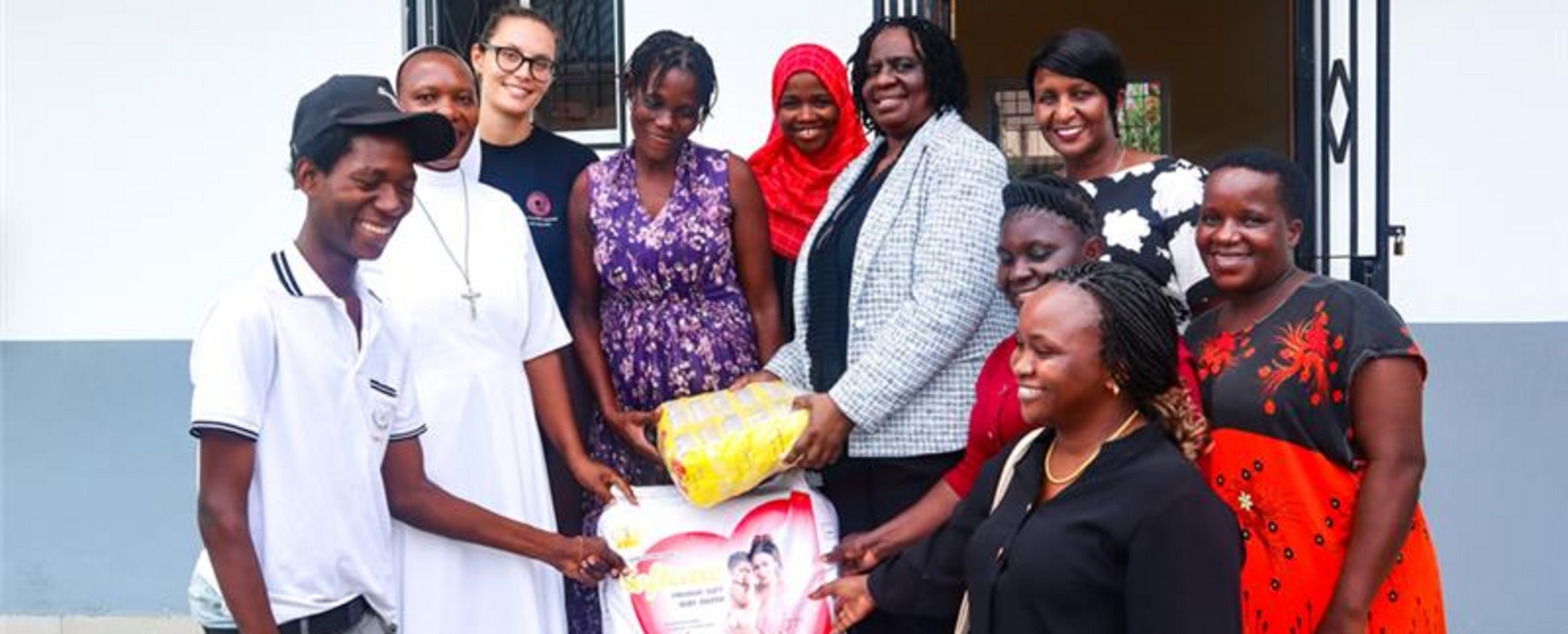 Group photo of CGIAR women with Center management and parents of children living with disabilities during international Women Day(Photo credit: ILRI/Gloriana Ndibalema)