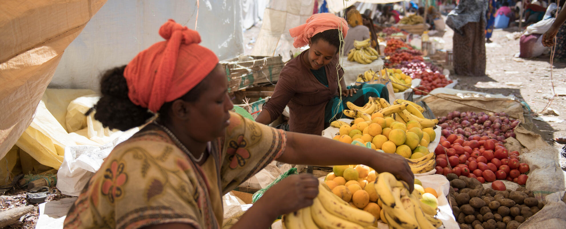 Women in the market (fruit products)